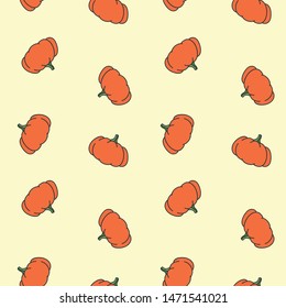Seamless background with orange pumpkins on light yellow background. Vector 8 EPS.