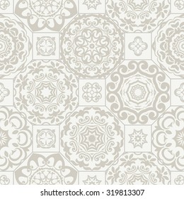 Seamless background with ornamental white and light grey colored pattern