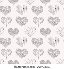 Seamless background with ornated hearts