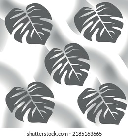 seamless background with palm leaves on a gray background. A spectacular pattern for decoration.