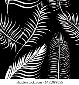A seamless background of palm leaves. Vector illustration