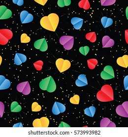 Seamless background with ?olor paper hearts on the dark background. Valentines Day