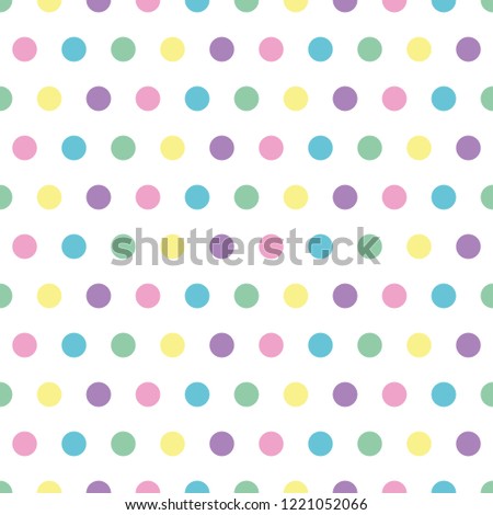 seamless background of pastel colored polka dots on white