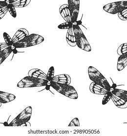 Seamless background with a pattern of Acherontia atropos. Graphic art. Hand drawn