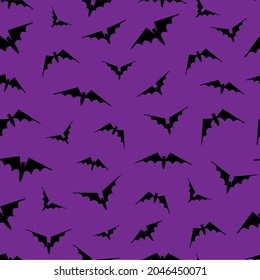 Seamless background (pattern) with bats on violet background. Hand drawn vector illustration. October 31. Holiday concept for Halloween.