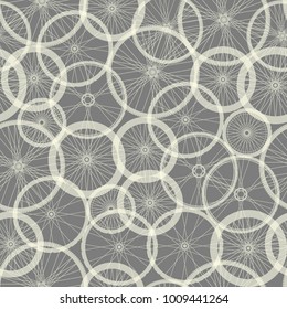 Seamless background pattern. Pattern of bycicles wheels.