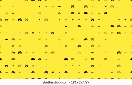 Seamless background pattern of evenly spaced black joystick symbols of different sizes and opacity. Vector illustration on yellow background with stars