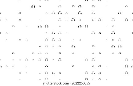 Seamless background pattern of evenly spaced black headphones symbols of different sizes and opacity. Vector illustration on white background