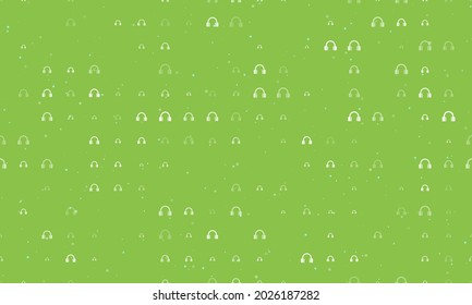 Seamless background pattern of evenly spaced white headphones symbols of different sizes and opacity. Vector illustration on light green background with stars