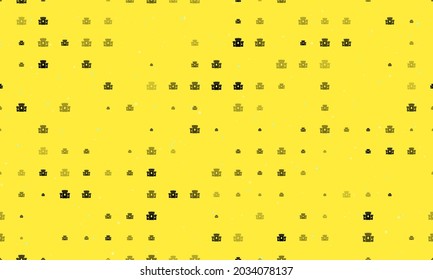 Seamless background pattern of evenly spaced black castle symbols of different sizes and opacity. Vector illustration on yellow background with stars