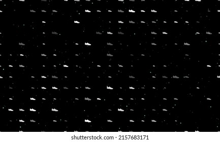 Seamless background pattern of evenly spaced white football boot symbols of different sizes and opacity. Vector illustration on black background with stars