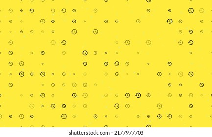 Seamless background pattern of evenly spaced black time back symbols of different sizes and opacity. Vector illustration on yellow background with stars
