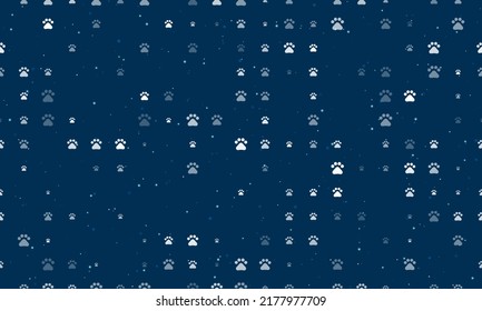 Seamless background pattern of evenly spaced white pet symbols of different sizes and opacity. Vector illustration on dark blue background with stars