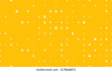 Seamless background pattern of evenly spaced white pet symbols of different sizes and opacity. Vector illustration on amber background with stars