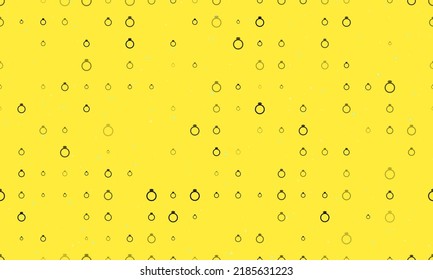 Seamless background pattern of evenly spaced black diamond ring symbols of different sizes and opacity. Vector illustration on yellow background with stars