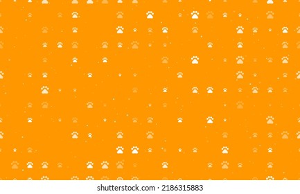 Seamless background pattern of evenly spaced white pet symbols of different sizes and opacity. Vector illustration on orange background with stars