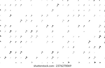 Seamless background pattern of evenly spaced black hammer symbols of different sizes and opacity. Vector illustration on white background