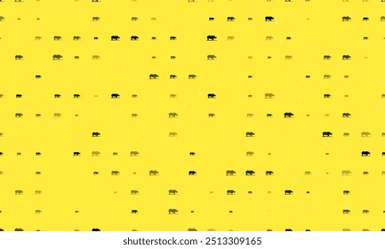 Seamless background pattern of evenly spaced black wild rhino symbols of different sizes and opacity. Vector illustration on yellow background with stars