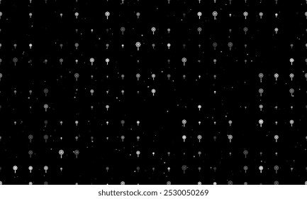 Seamless background pattern of evenly spaced white chamomile symbols of different sizes and opacity. Vector illustration on black background with stars