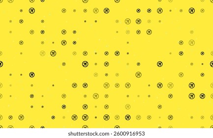 Seamless background pattern of evenly spaced black no left turn signs of different sizes and opacity. Vector illustration on yellow background with stars