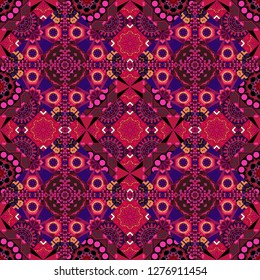Seamless background pattern. Folk ethnic floral ornamental mandala in brown, purple and red colors. Vector abstract colorful painted kaleidoscopic graphic background.
