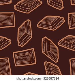 Seamless background with a pattern of hand drawn pieces of chocolate