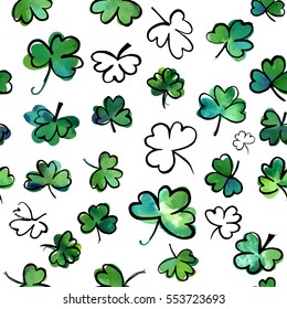 A seamless background pattern with hand drawn vector, watercolour and ink shamrocks