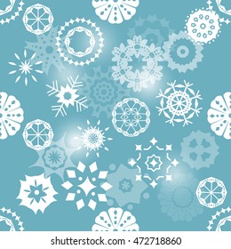 A seamless background pattern with many different snowflakes on teal blue background; a festive Christmas repeat print; scalable vector graphic