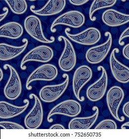 Seamless background pattern. Paisley pattern in indian style with curly ornament. Navy blue background.
