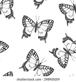 Seamless background with a pattern of Papilio machaon. Graphic art. Hand drawn