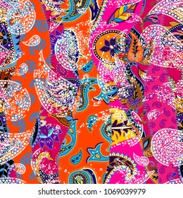 Seamless background pattern. Patchwork pattern with Paisley ornament patterns. Bright magenta and orange colors. Ethnic indian style.