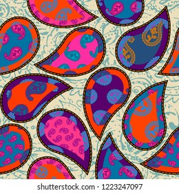 Seamless background pattern. Patchwork pattern with Paisley ornament patterns. Bright magenta and orange colors. Ethnic indian style.