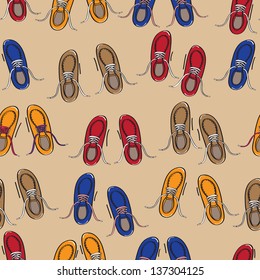 Seamless background pattern of rows of colourful casual shoes or sneakers with laces on a beige background