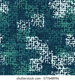 Seamless background. The pattern of squares. Chaotic Spot. Fashion camouflage. Grungy textiles.