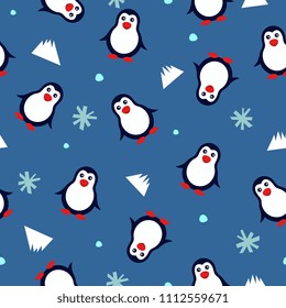 seamless background with penguins and snowflakes on a blue background