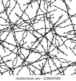 Seamless background of pieces of barbed wire