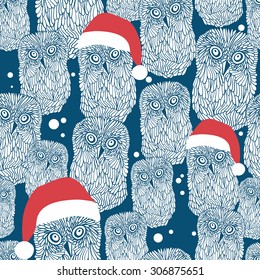 Seamless background with polar owls in christmas hats. Vector winter illustration.