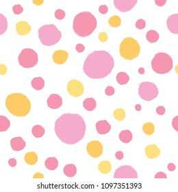Seamless background in polka dots in pink and yellow tones. Vector design for cover, print, textile or wrapp paper.