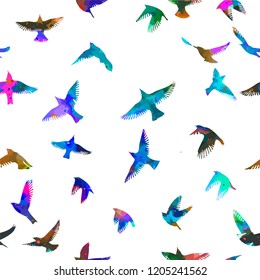 Seamless background of rainbow birds flying. Vector