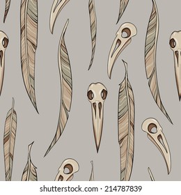 Seamless background of raven's skulls and feathers