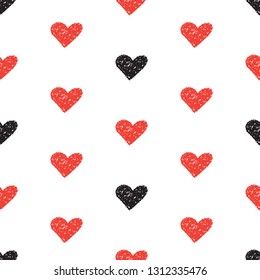 Seamless background with red and black hearts in crayon style on a white backdrop