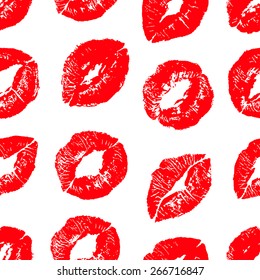 Seamless background with red colors lips prints on white background