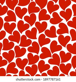 Seamless background of red hearts. For design of printed materials for Valentine's Day.