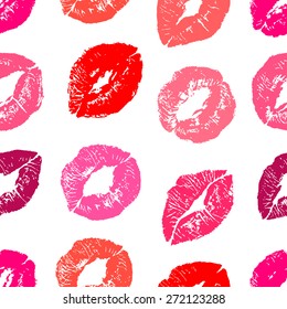 Seamless background with red and pink colors lips prints on white background