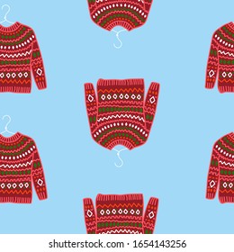 Seamless background with red  sweater with ornament. seamless background needlework, handmade. needlework store