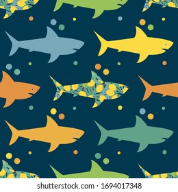 Seamless background with sharks. Texture with tropical fruits and leaves. Predator in the sea. Vector illustration for web design or print.