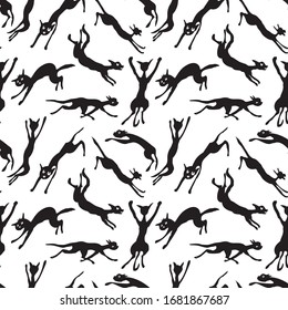 Seamless background of silhouettes jumping and running cats