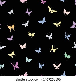Seamless background of silhouettes of various decorative butterflies