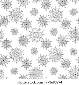 Seamless a background with snowflakes in black-and-white colour