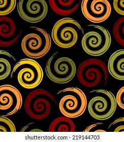 Seamless background with spiral motif in autumn colors on the black area